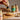 Mighty Kashoo - Cashew Mus pur - Squeezerflasche - Auf Brötchen mit Glas im Hintergrund - shopstartups - Startup-Produkte
